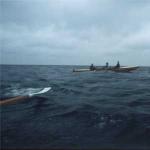 Ruderboot auf Welle Inrigger rudern